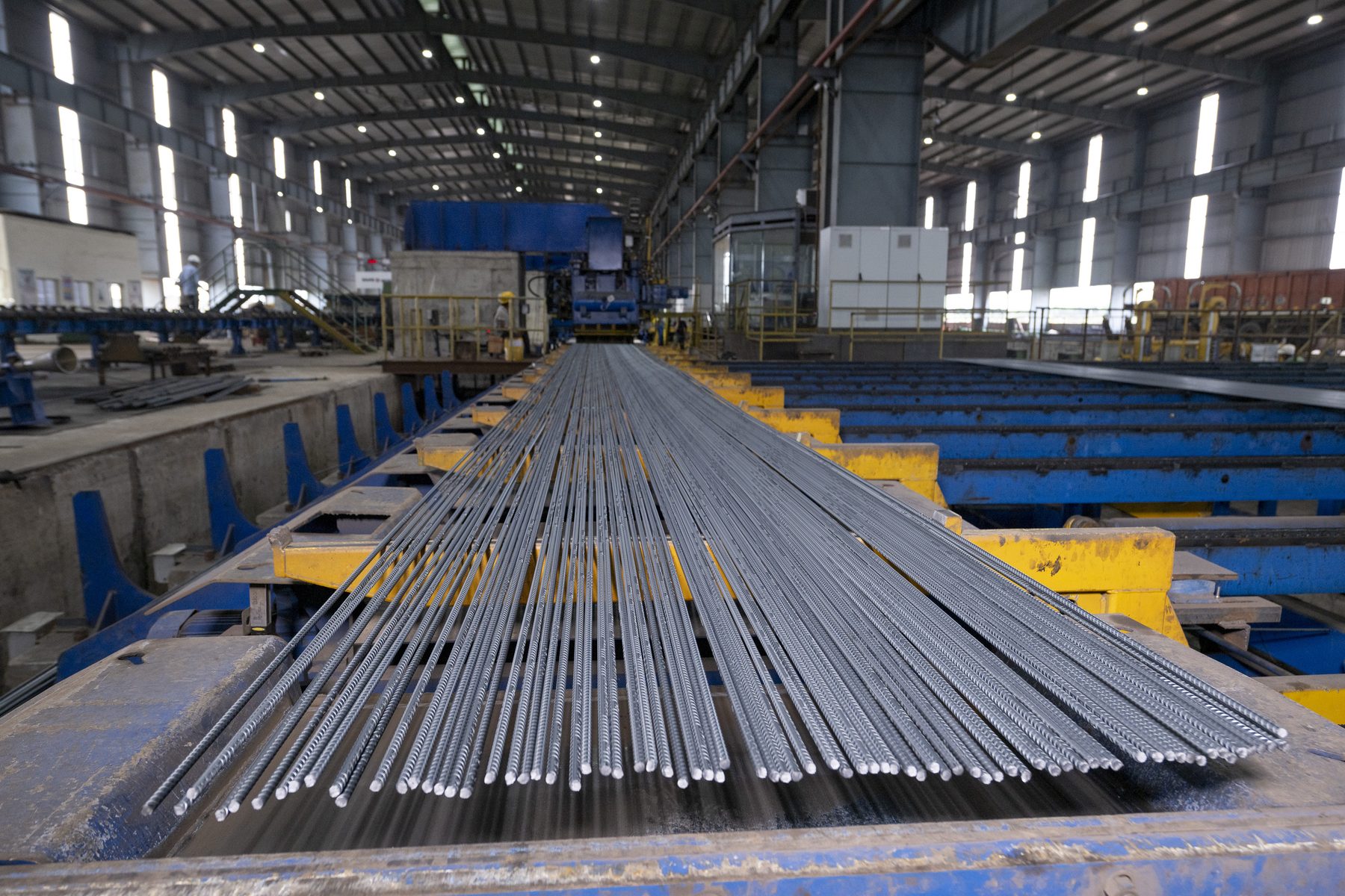 Ribbed bars spread across a cooling bed