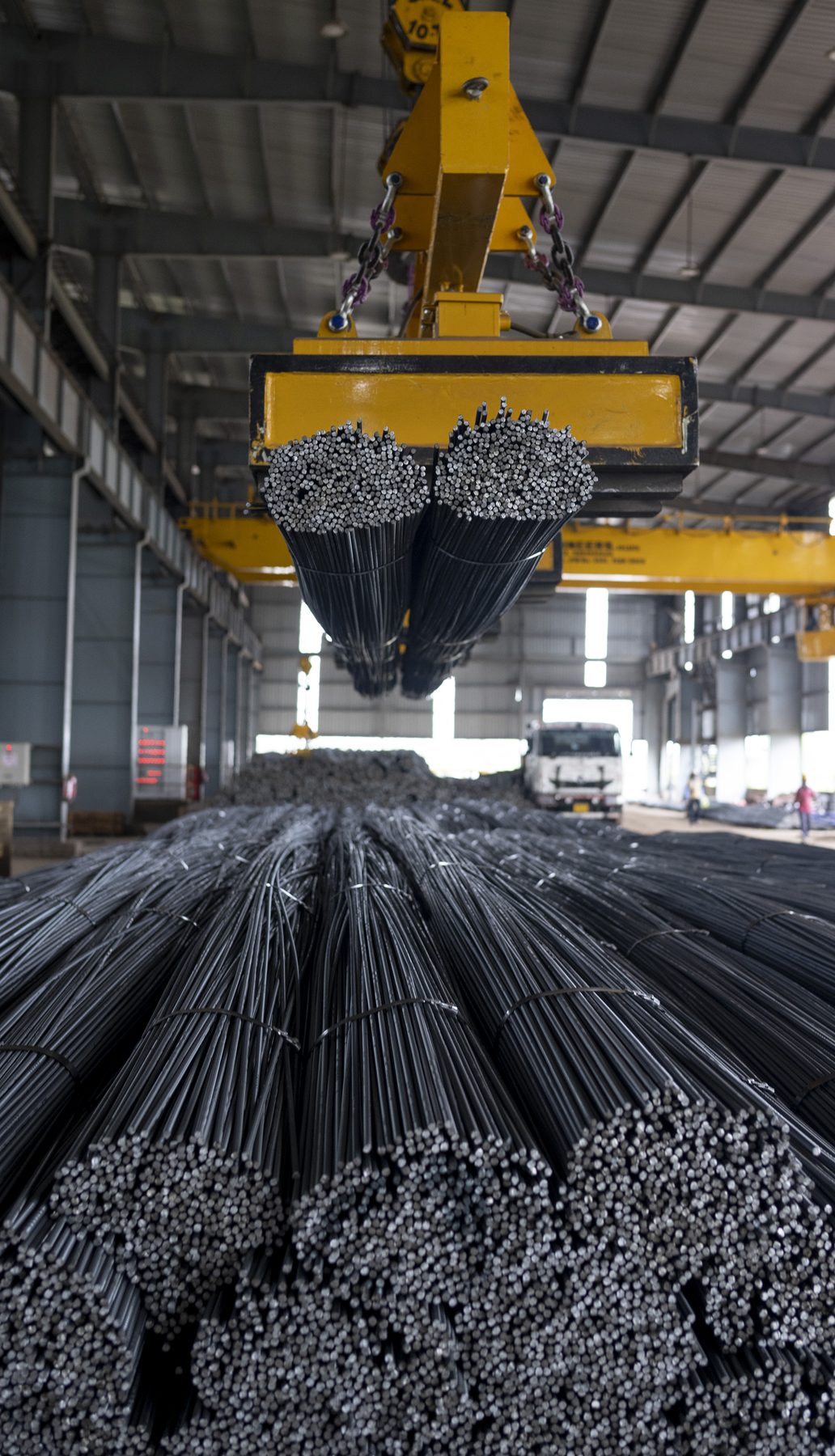 Crane carrying rebar bundles